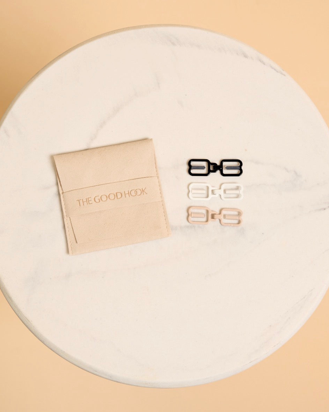 THE GOOD HOOK racerback bra converter clips in size NARROW in black, white and beige with THE GOOD HOOK storage pouch